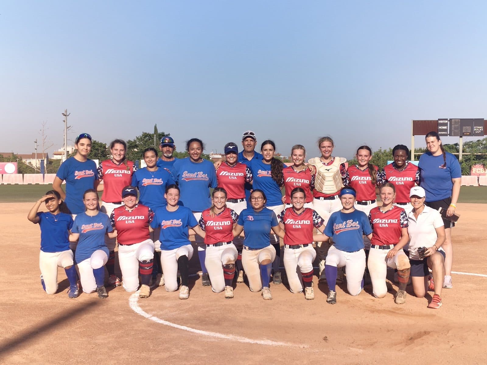 American softball team lined up on the field before a game on their Spain tour